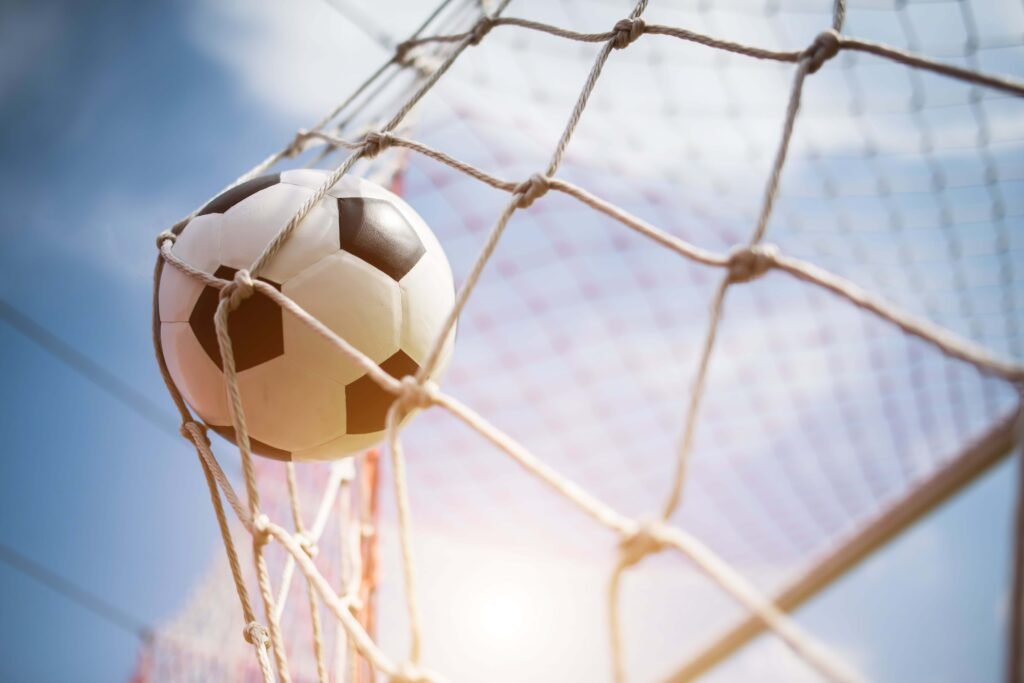 goal scored and the ball in the net
